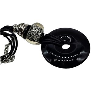 Mixed material necklace on cord with lucite pendant